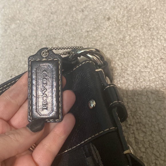 Coach black tote. Tons of wear left in it, selling as is. - Picture 2 of 5